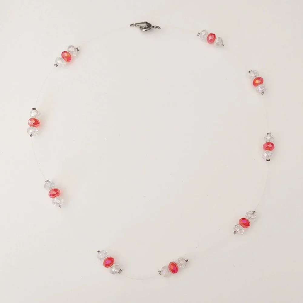 Floating clear and orange crystal necklace